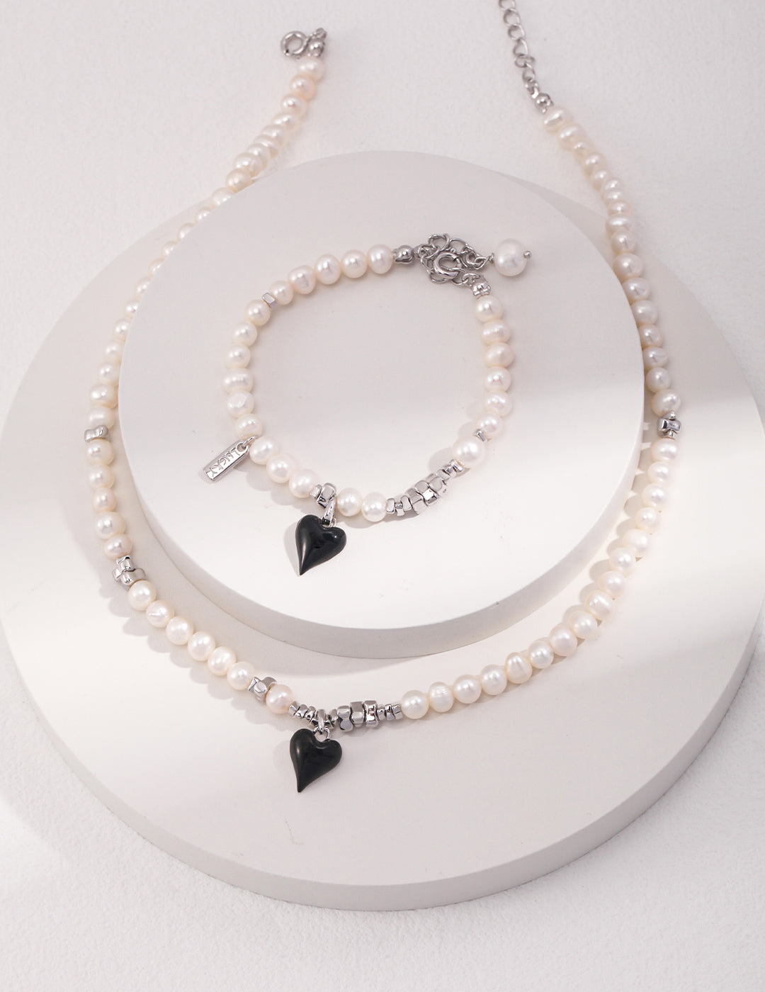 Sterling Silver French Pearl Necklace and Bracelet, featuring a classic heart design