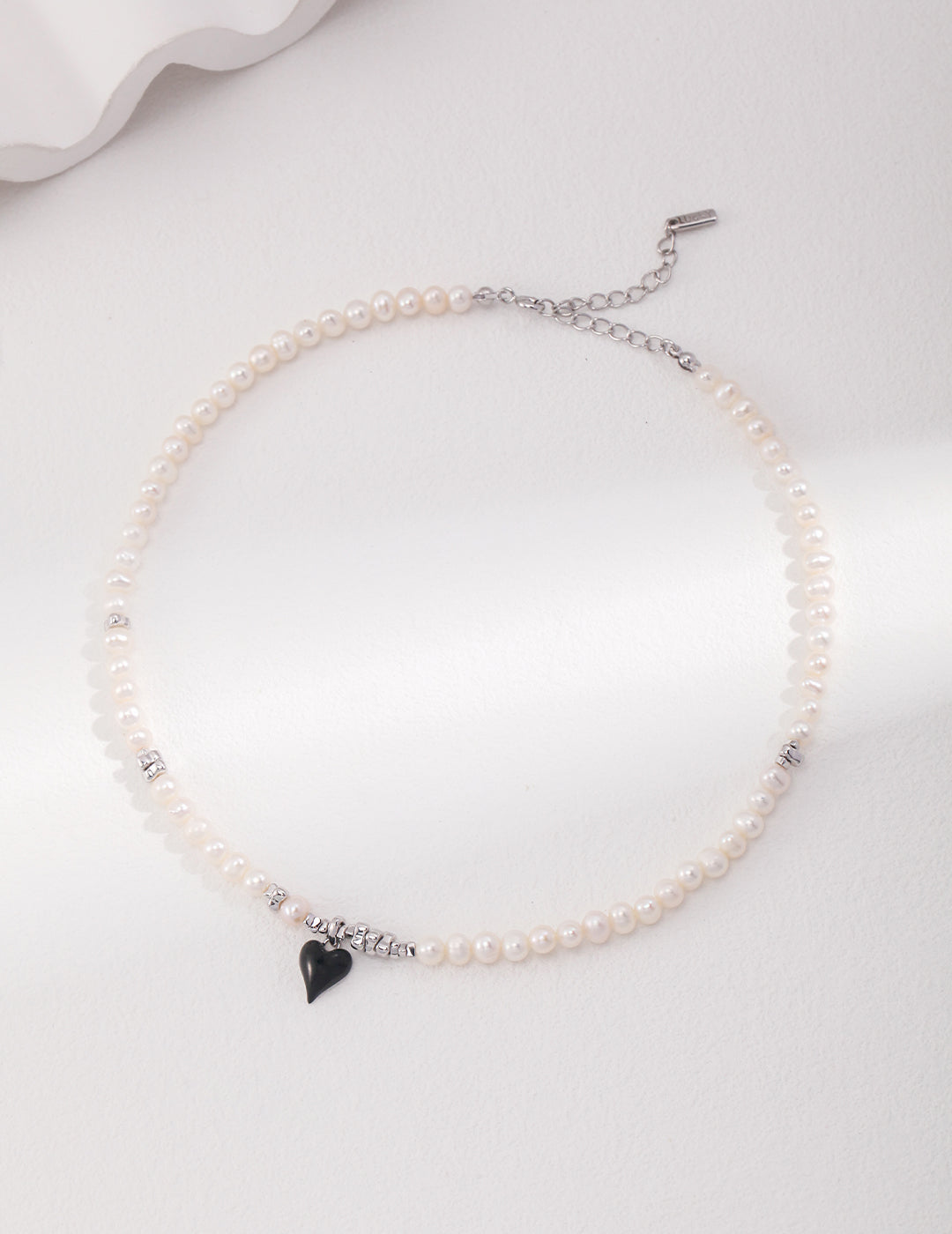 Sterling Silver French Pearl Necklace and Bracelet, featuring a classic heart design