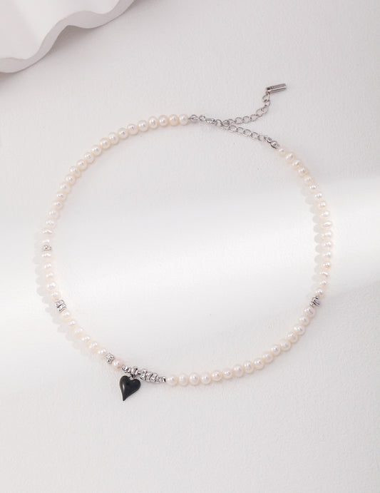 Sterling Silver French Pearl Necklace and Bracelet, featuring a classic heart design